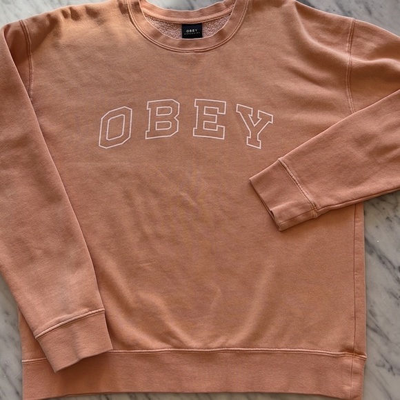 Obey Tops - OBEY women's CORE VARSITY ARCHED sweatshirt peach, small